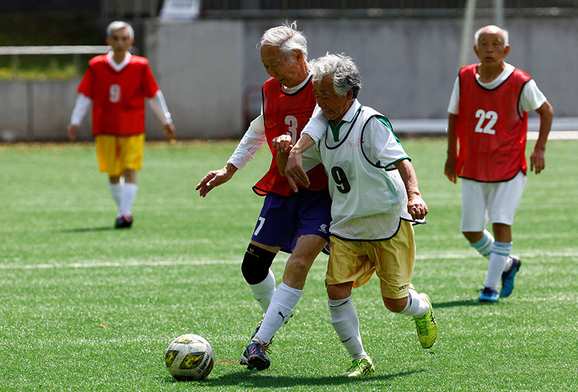 Red Star’s Takao Yokoyama (2nd to the left), 86, chases a ball against White Bear’s Kozo Ishida, 82, at the SFL (Soccer For Life) 80 League opening match in Tokyo, Japan. - REUTERS