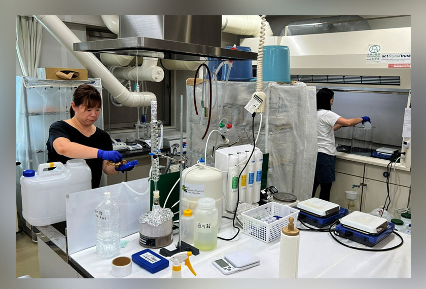 Members of Tarachine measure radiation levels in collected seawater at their lab in Iwaki, Fukushima Prefecture, Japan. - REUTERS
