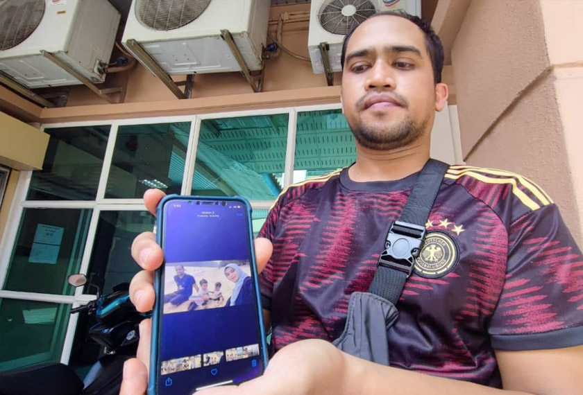 Suami jururawat yang maut, Syukur Zainol menunjukkan gambar kenangan  bersama isterinya. - Foto Astro AWANI