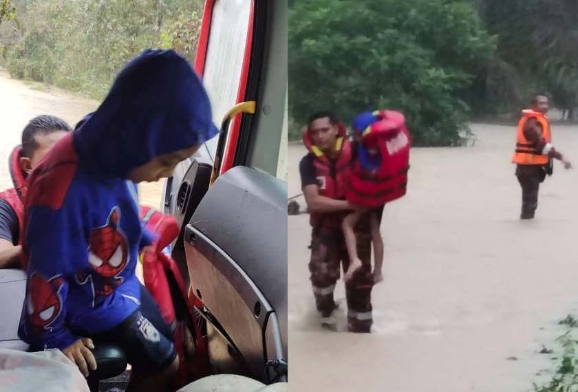 Anggota bomba menyelamatkan mangsa banjir di Sungai Karas, Labis. - Foto JBPM