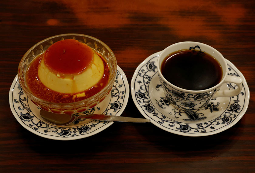 A pudding and a cup of coffee are pictured during a photo opportunity at Shizuo Mori’s Heckeln coffee shop in Tokyo, Japan March 15, 2023. - REUTERS