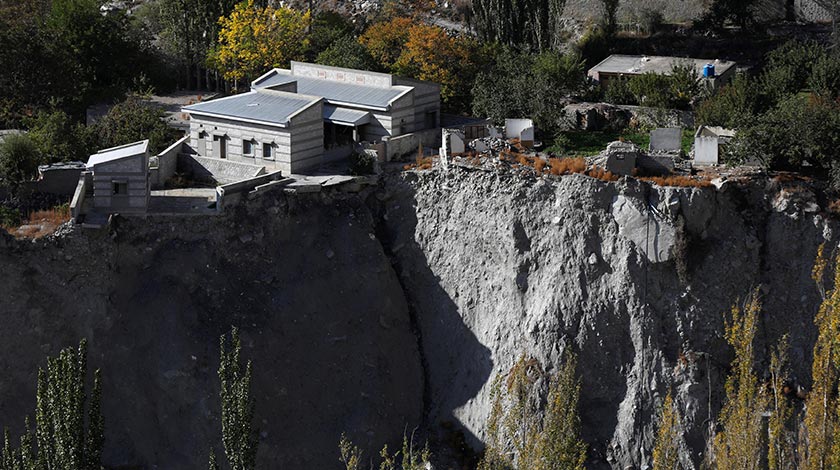 A community hall and houses show signs of damage after a Glacial Lake Outburst Flooding (GLOF) incident occurred from the nearby Shisper glacier, in Hassanabad village, Hunza valley, in the Karakoram mountain range in the Gilgit-Baltistan region of Pakistan. - REUTERS