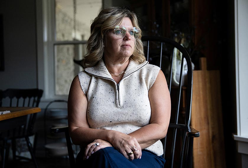 Dawn Heidlebaugh sits in her dining room in her home in Findlay, Ohio. - REUTERS