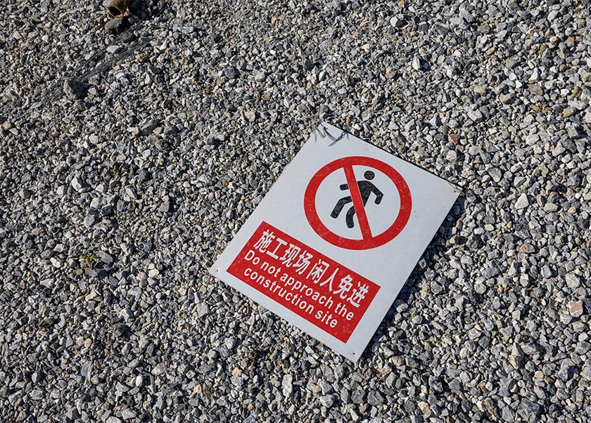 A construction site sign is seen on the ground in the village of Krivelj, Serbia. - Marko Djurica/REUTERS