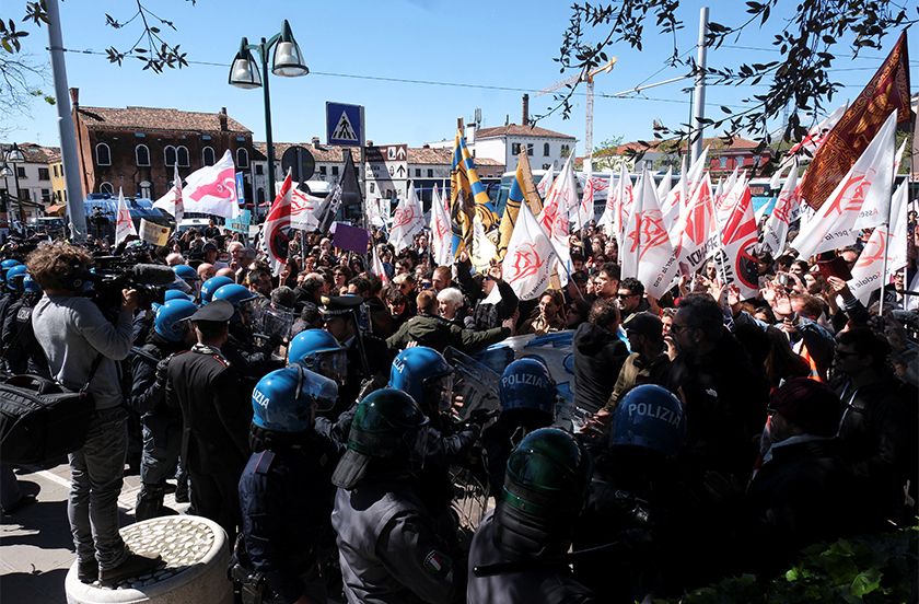 People clash with police as they protest against the introduction of the registration and tourist fee to visit the city of Venice for day trippers introduced by Venice municipality in a move to preserve the lagoon city often crammed with tourists in Venice, Italy, April 25, 2024. - REUTERS