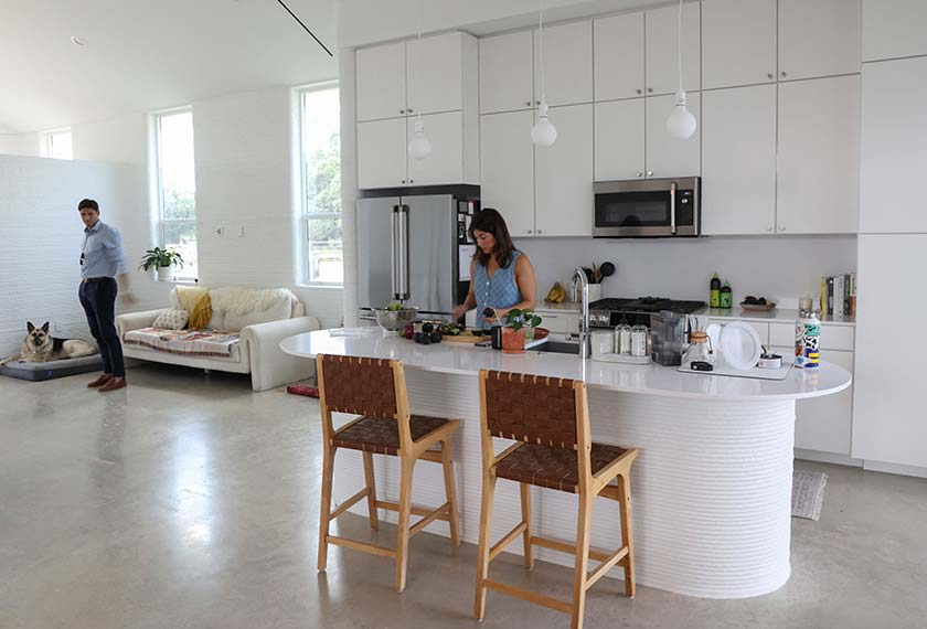 Lawrence Nourzad and Angela Hontas spend time in their newly purchased 3D-printed home in Georgetown, Texas. - REUTERS