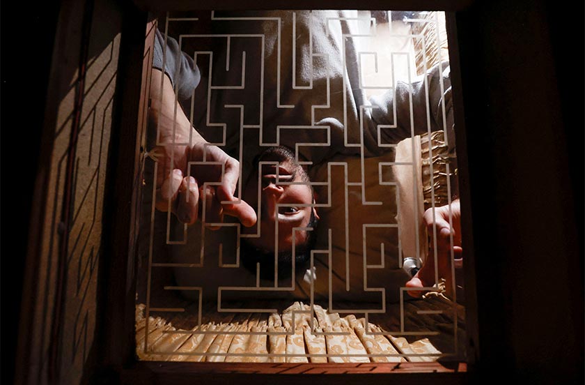 Gamer Carlos Granedo tries to solve a maze while participating in an extreme escape room named Catalepsia, Barcelona, Spain. - REUTERS