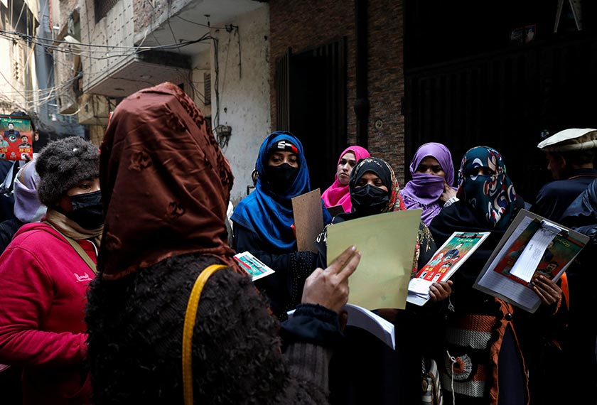 Komal Asghar, 25, (2nd-L) a teacher and supporter of former Prime Minister Imran Khan, speaks with fellow teachers before they start a door-to-door campaign, ahead of the general elections in Lahore, Pakistan. - REUTERS