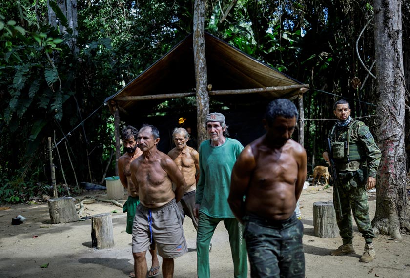 Illegal miners are detained by a members of the Special Inspection Group from the Brazilian Institute of Environment and Renewable Natural Resources (IBAMA) during an operation against illegal mining in Yanomami Indigenous land, Roraima state, Brazil. - REUTERS/Ueslei Marcelino  