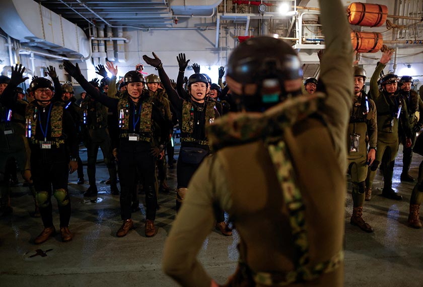 Japanese Ground Self-Defense Force's Amphibious Rapid Deployment Brigade (ARDB) soldiers take part in military training inside the Japanese Maritime Self-Defense Force's amphibious transport ship JS Shimokita (LST-4002) in waters close to Tokunoshima Island, Japan. - REUTERS