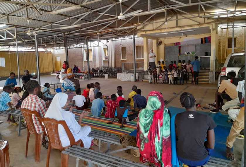 Refugees attend an event at 