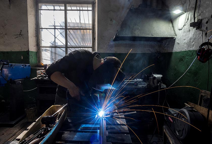 Yaroslav works in Dmytro Mamonov’s workshop where they produce remote-controlled medical evacuation vehicles for the military. - REUTERS