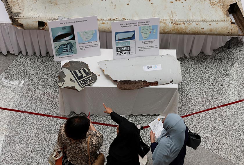 Visitors look at the wreckage of an aircraft believed to be from the missing Malaysia Airlines flight MH370 during a remembrance event marking the 10th anniversary of its disappearance, in Subang Jaya, Malaysia March 3, 2024. - REUTERS