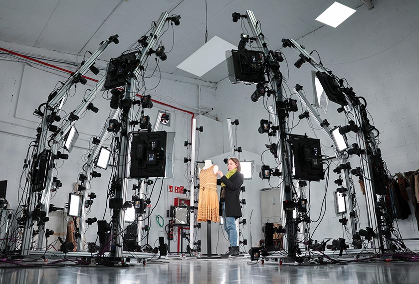 A woman prepares a costume to be scanned and digitalized at a Peris Costumes facility that produces and stores costumes for Hollywood blockbusters such as The Little Mermaid and Cruella or popular Netflix series such as Bridgerton and Emily in Paris, in Algete, Madrid region, Spain. - REUTERS