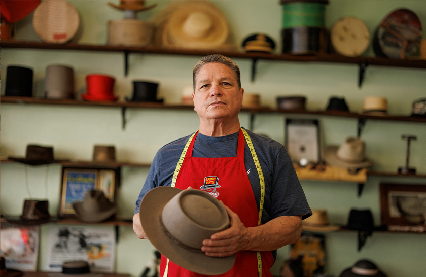 Owner of Baron Hats and hatmaker Mark Mejia holds a replica hat made for actor Cillian Murphy in the Oppenheimer movie from his hat factory in Los Angeles, California, US. - REUTERS