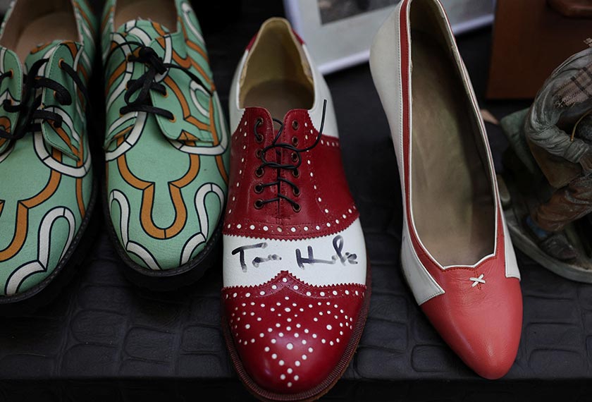 A view shows American actor Tom Hank's signature on a shoe at a Peris Costumes facility that produces and stores costumes for Hollywood blockbusters such as The Little Mermaid and Cruella or popular Netflix series such as Bridgerton and Emily in Paris, in Algete, Madrid region, Spain. - REUTERS