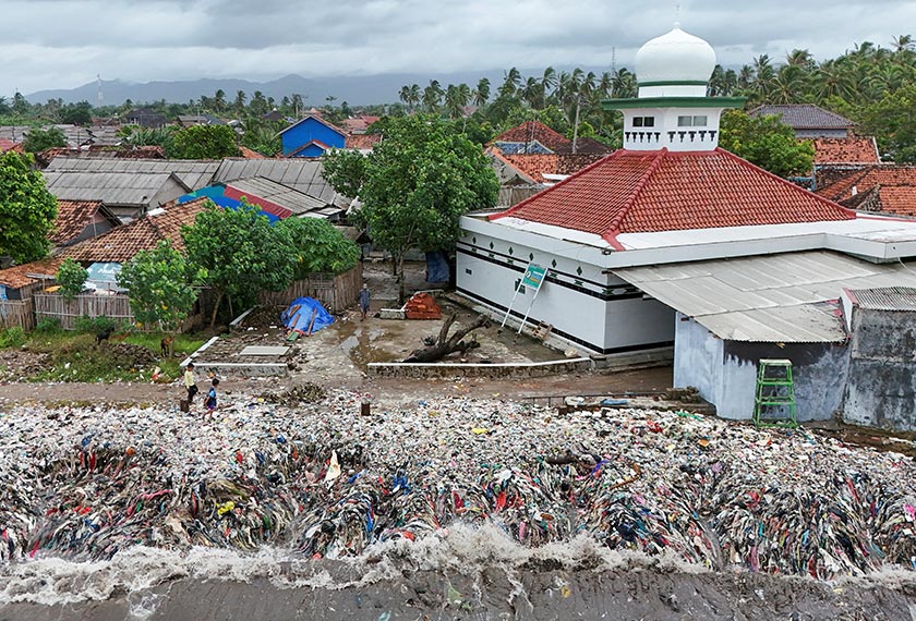 A drone view shows trash being swept to the shore due to high tides caused by erratic weather, on a beach in Teluk fishing village, in Pandeglang regency, Banten province, Indonesia. - REUTERS