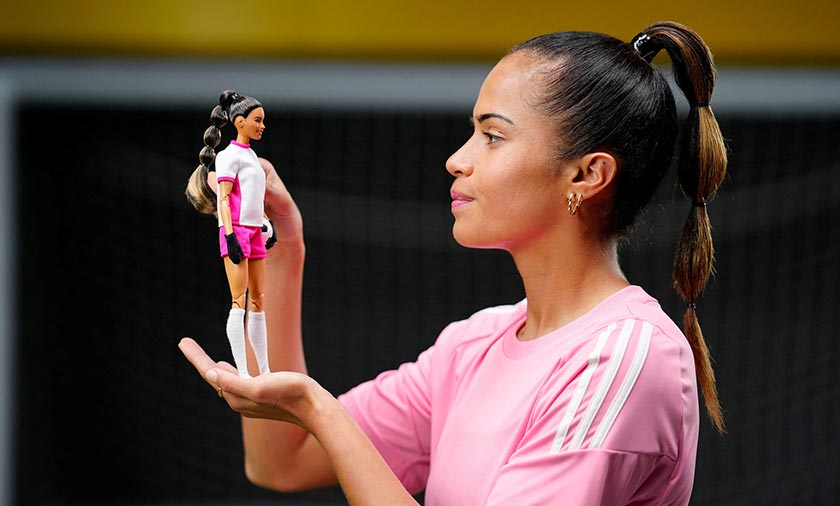 Australian and Manchester City W.F.C. football player, Mary Fowler, poses with a Barbie doll, in Manchester, Britain. - Mattel/Michael Bowles/via REUTERS 