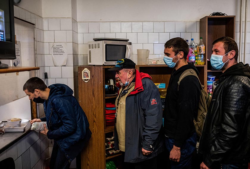 David Simonics, 26, waits for his dinner at the homeless shelter on Danko Street in Budapest, Hungary. - REUTERS/Filepic