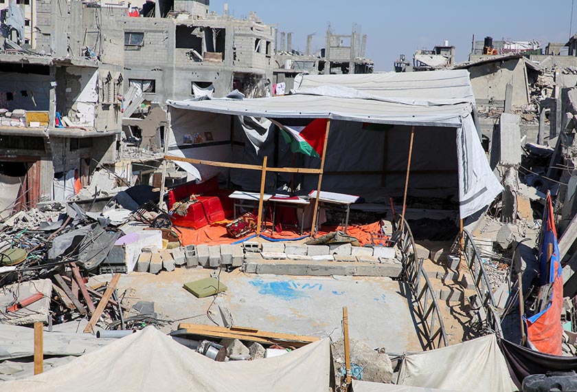 A classroom tent is set up on the rubble of the house of Palestinian teacher Israa Abu Mustafa, who took the initiative to educate children in her neighborhood, as war disrupts a new school year, in Khan Younis, in the southern Gaza Strip, September 4, 2024. - REUTERS