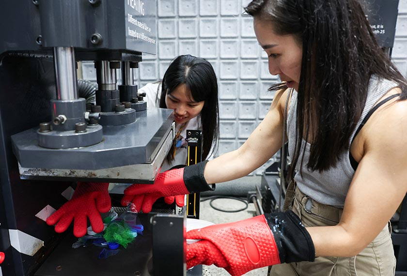 Debbie Wu operates miniTrashpresso, which turns plastic waste into materials to make sunglasses, at Trash Kitchen in Taipei, Taiwan. - REUTERS