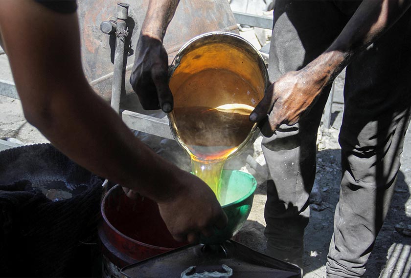 Palestinians collect alternative fuel produced by burning plastic waste amid scarcity as the Israel-Hamas conflict continues, in northern Gaza Strip. - REUTERS