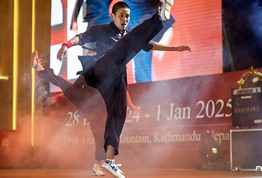 A Kung Fu nun demonstrates her skills during the reopening of the nunnery for the first time since the COVID-19 closure at Druk Amitabha Mountain Nunnery in Kathmandu, Nepal. - REUTERS/Navesh Chitrakar