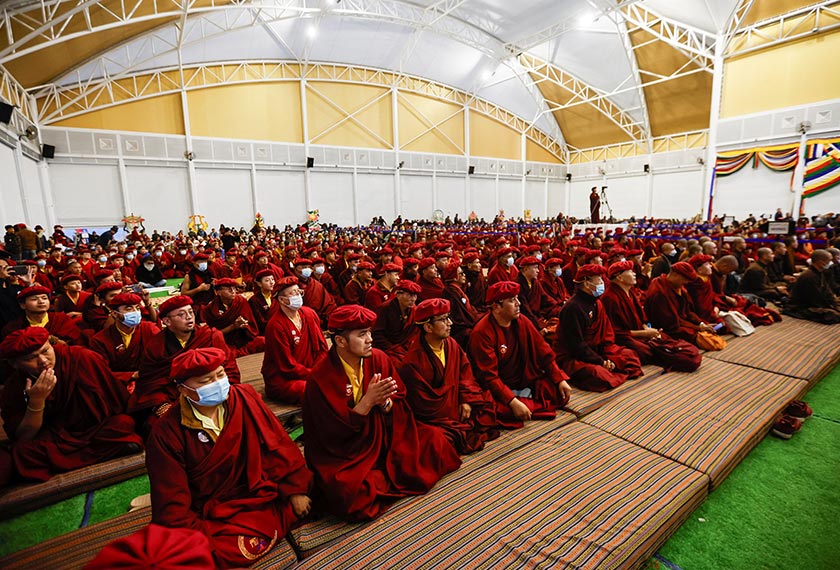 A group of monks, along with nuns and invitees, attend the reopening of the nunnery for the first time since the COVID-19 closure at Druk Amitabha Mountain Nunnery in Kathmandu, Nepal. - REUTERS/Navesh Chitrakar 