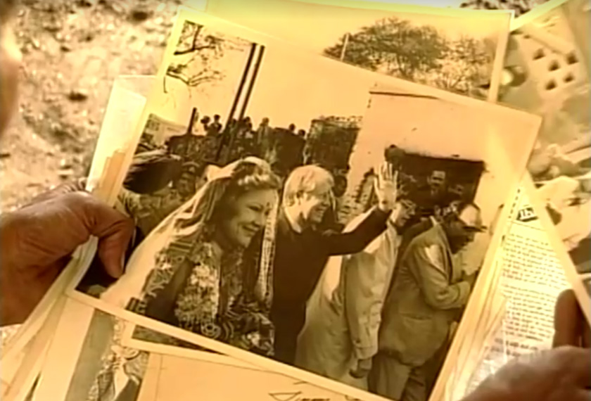 Villagers show photograph of Jimmy Carter and his wife Rossalyn Carter when they visited the village in Carterpuri, Haryana, India. - Screengrab/ANI/via REUTERS