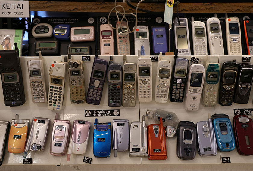 Old model cell phones are displayed at Extinct Media Museum, a private museum showcasing a collection of defunct gadgets including old cameras, cassette tapes and cell phone, in Tokyo, Japan. - REUTERS