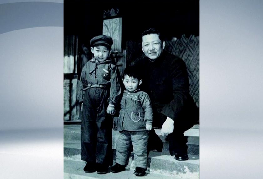 Filepic shows Xi Jinping (L), his younger brother Xi Yuanping, and their father Xi Zhongxun, China - 1958. (Pictorial Biography of Xi Zhongxun) - CCTV/via REUTERS