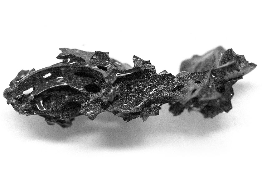 A fragment of the organic glass that was found inside the skull of the deceased individual, who was killed in the eruption of Mount Vesuvius in 79 AD, at the archaeological site of Herculaneum in Italy, is pictured in this handout image released on February 27, 2025. - Pier Paolo Petrone/REUTERS