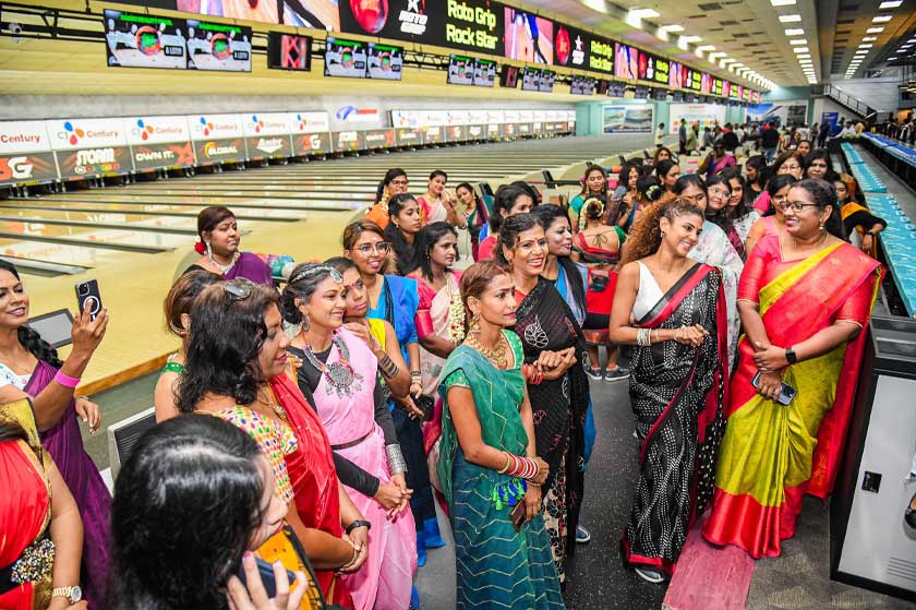 Participants listen attentively as organisers from PAAVAI Looms Empire brief them before the start of the 'Saree Up to Strike' Bowling Tournament, Sunway Mega Lanes, Sunway Pyramid, March 8, 2025. Credit: Moganraj Villavan