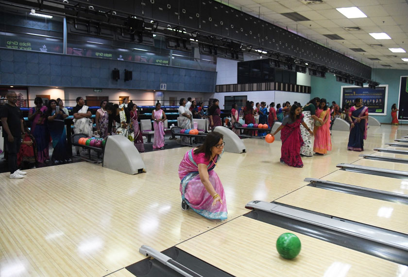 A participant delivers her shot with precision at the 'Saree Up to Strike' Bowling Tournament, held at Sunway Mega Lanes, Sunway Pyramid, March 8, 2025. Credit: Moganraj Villavan