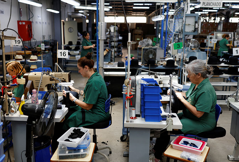 People work at 140-year-old Fernandez y Roche Industrias Sombrereras Espanolas factory, which produces Orthodox Jewish hats, in Salteras, near Seville, southern Spain, May 23, 2025. - REUTERS/Marcelo del Pozo/Filepic