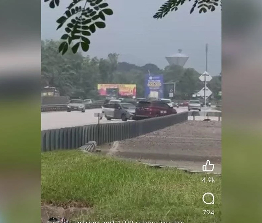 Tangkap layar video tular memaparkan kejadian kejar di antara polis dan suspek berhampiran Hentian Rehat dan Rawat Behrang pada Sabtu. - Foto Sinar Harian