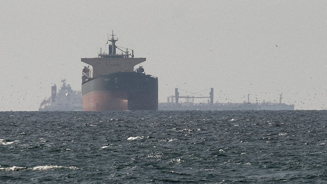 FILE PHOTO: Cargo ships in the Gulf, near the Strait of Hormuz, as seen from northern Ras al-Khaimah, near the border with Oman’s Musandam governance, amid the U.S.-Israeli conflict with Iran, in United Arab Emirates, March 11, 2026. REUTERS/Stringer/File Photo/File Photo