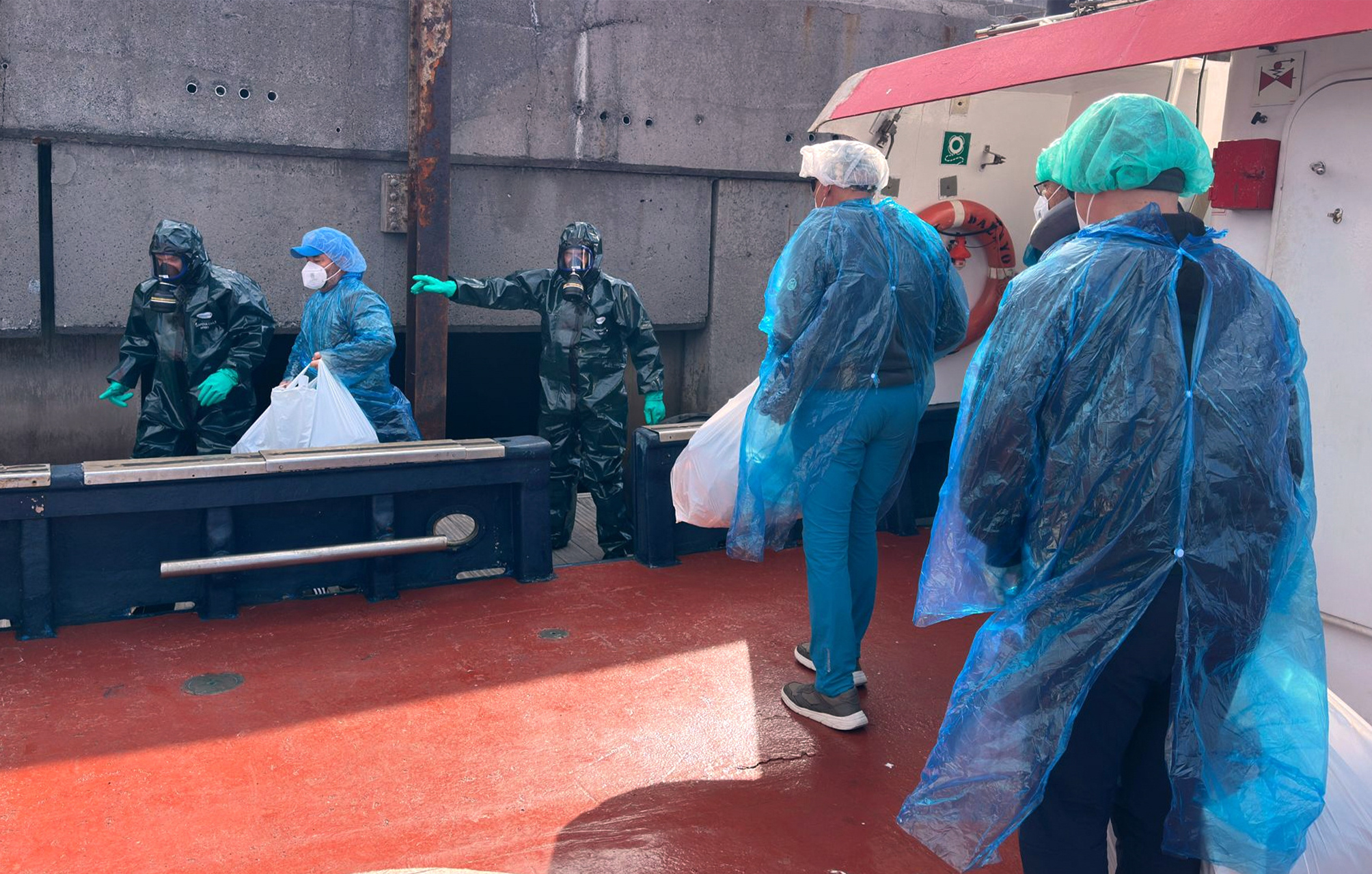 Passengers are disembarked from the hantavirus-stricken cruise ship MV Hondius at the port of Granadilla in Tenerife, Canary Islands, Spain, Sunday, May 10, 2026. (AP Photo)